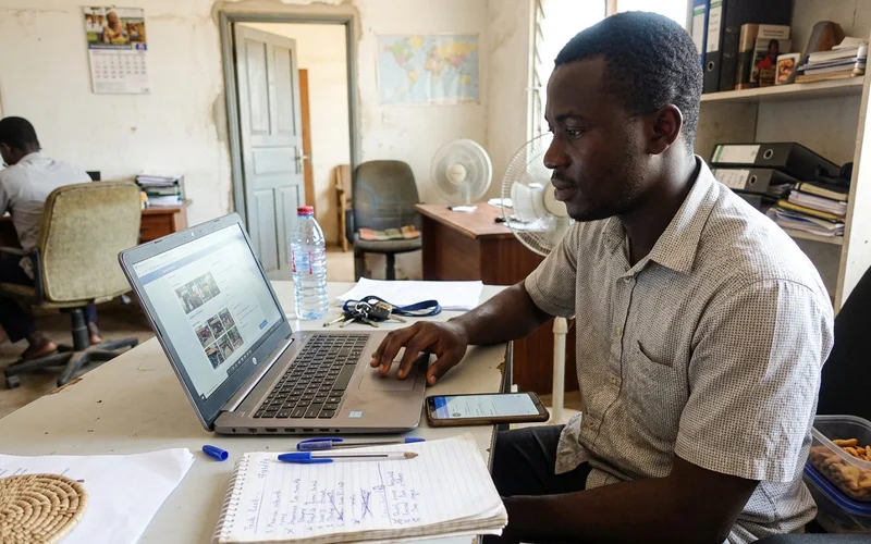 Team member updating a client's Google Business Profile with geo-tagged photos