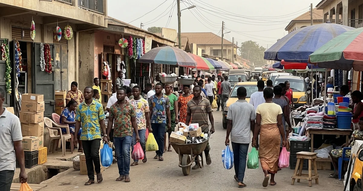 Festive shopping street in Kumasi in December with shoppers and decorated shops
