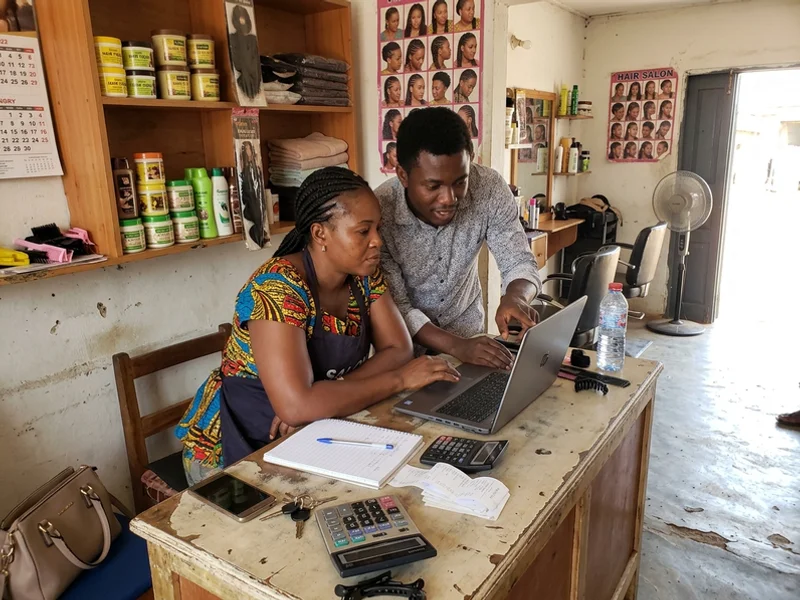 Account manager and salon owner reviewing a 180-day marketing plan