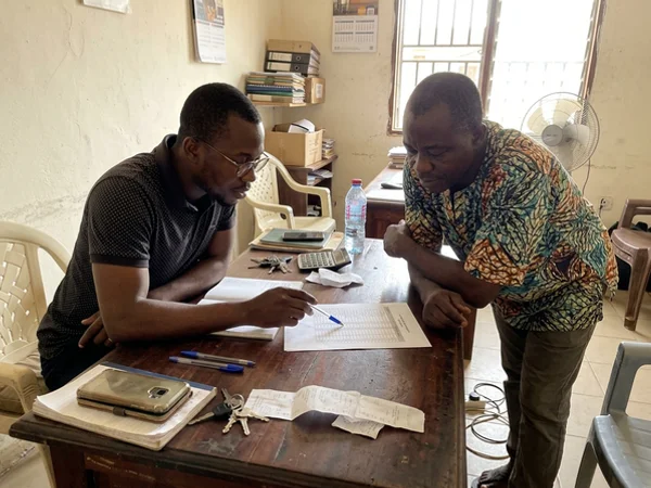 Account manager reviewing a monthly ranking report with a business owner